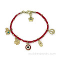 Pulsera con colgante pequeño mal de ojo Hamsa pulsera tejida